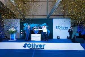 Oliver global leadership team participate in globe ceremony. 